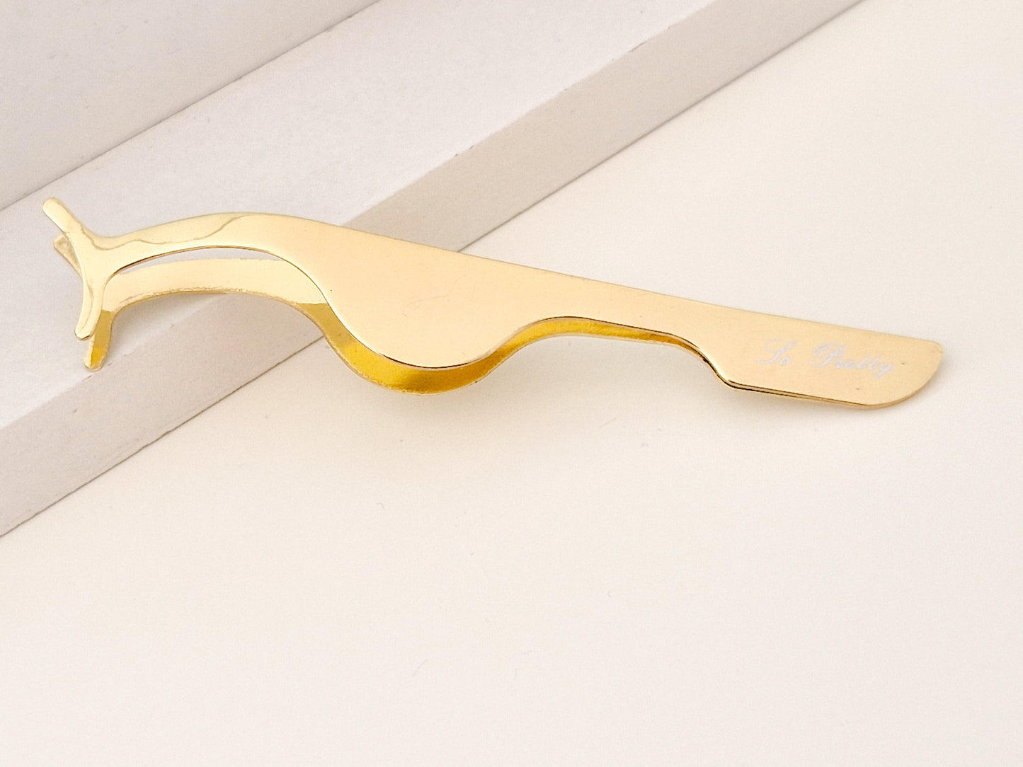 Eyelash curler/tweezer