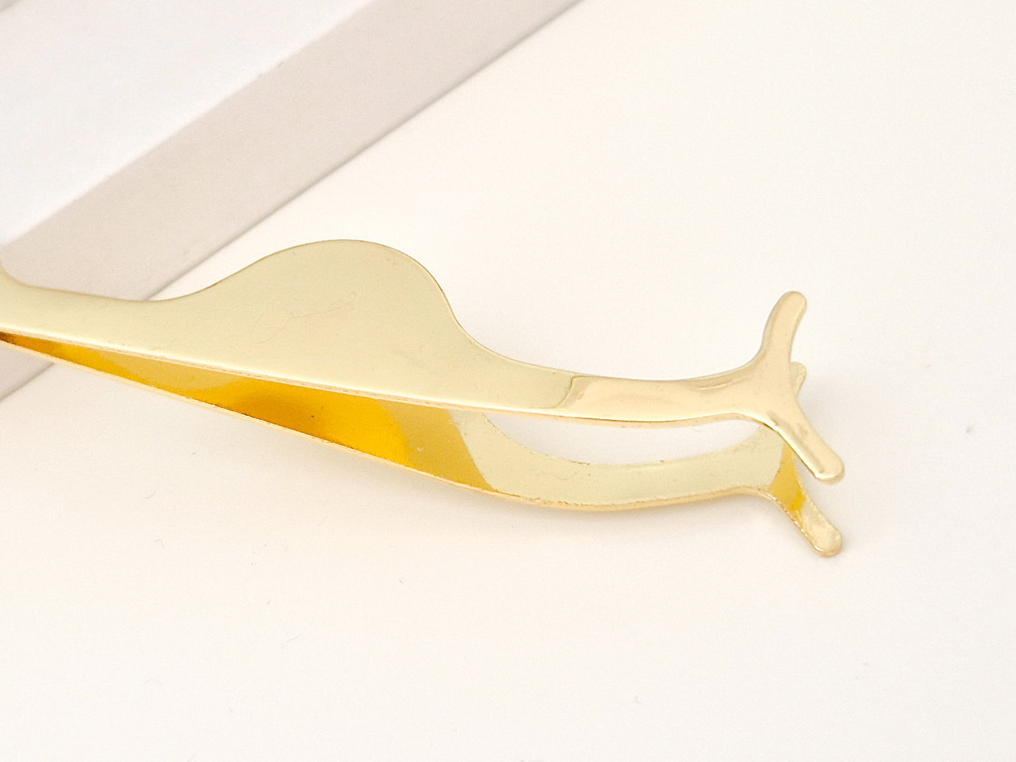 Eyelash curler/tweezer