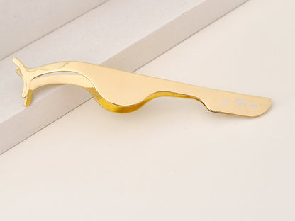 Eyelash curler/tweezer
